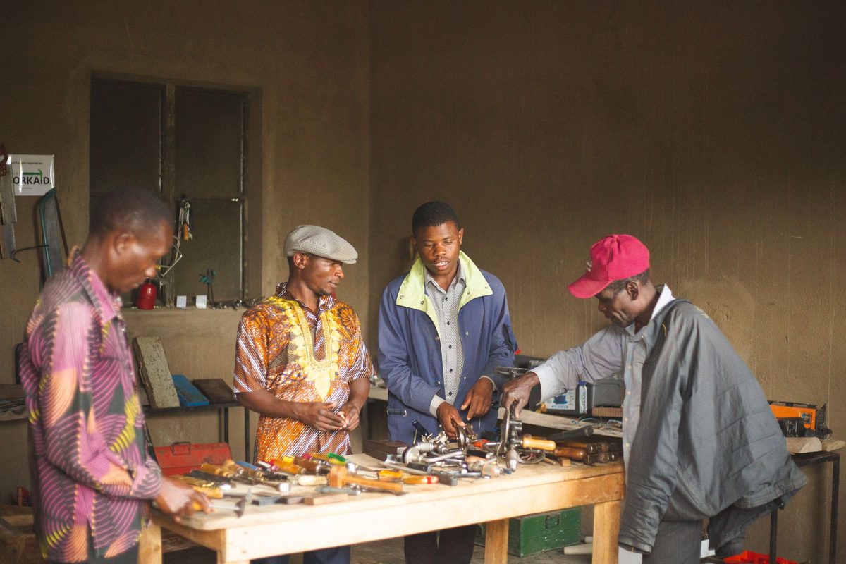 Volunteers working together in a community workshop